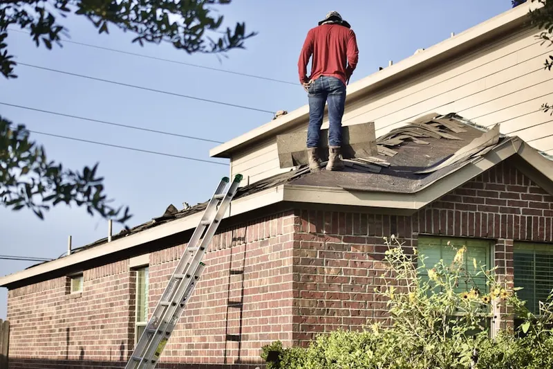 Professional roofer working on a residential roof in North Woodridge